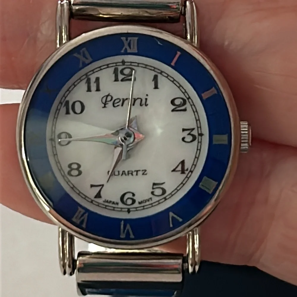Two vintage quartz watches one stainless steel with hearts one with blue trim